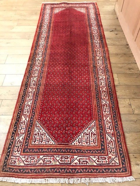 An Arak rug 322 x 108cm